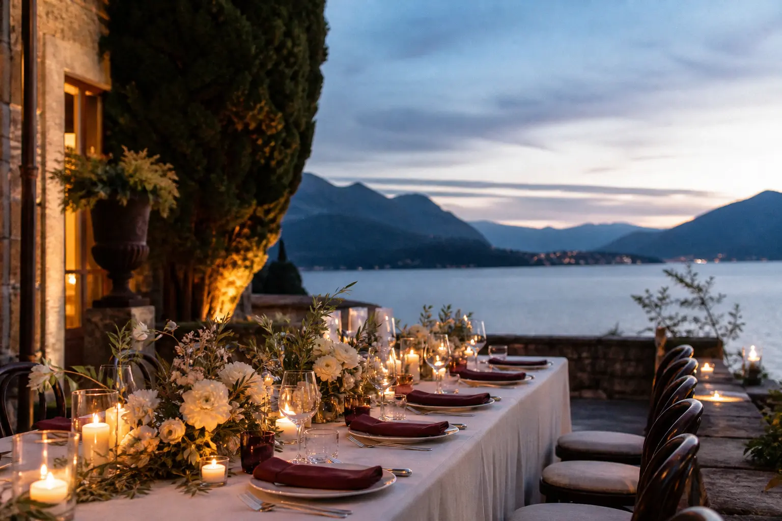 An intimate candlelit wedding table on a fictional Italian villa terrace